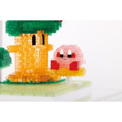 A colorful, pixelated character resembling a character from a video game, with a green tree-like structure and a pink, smiling face.