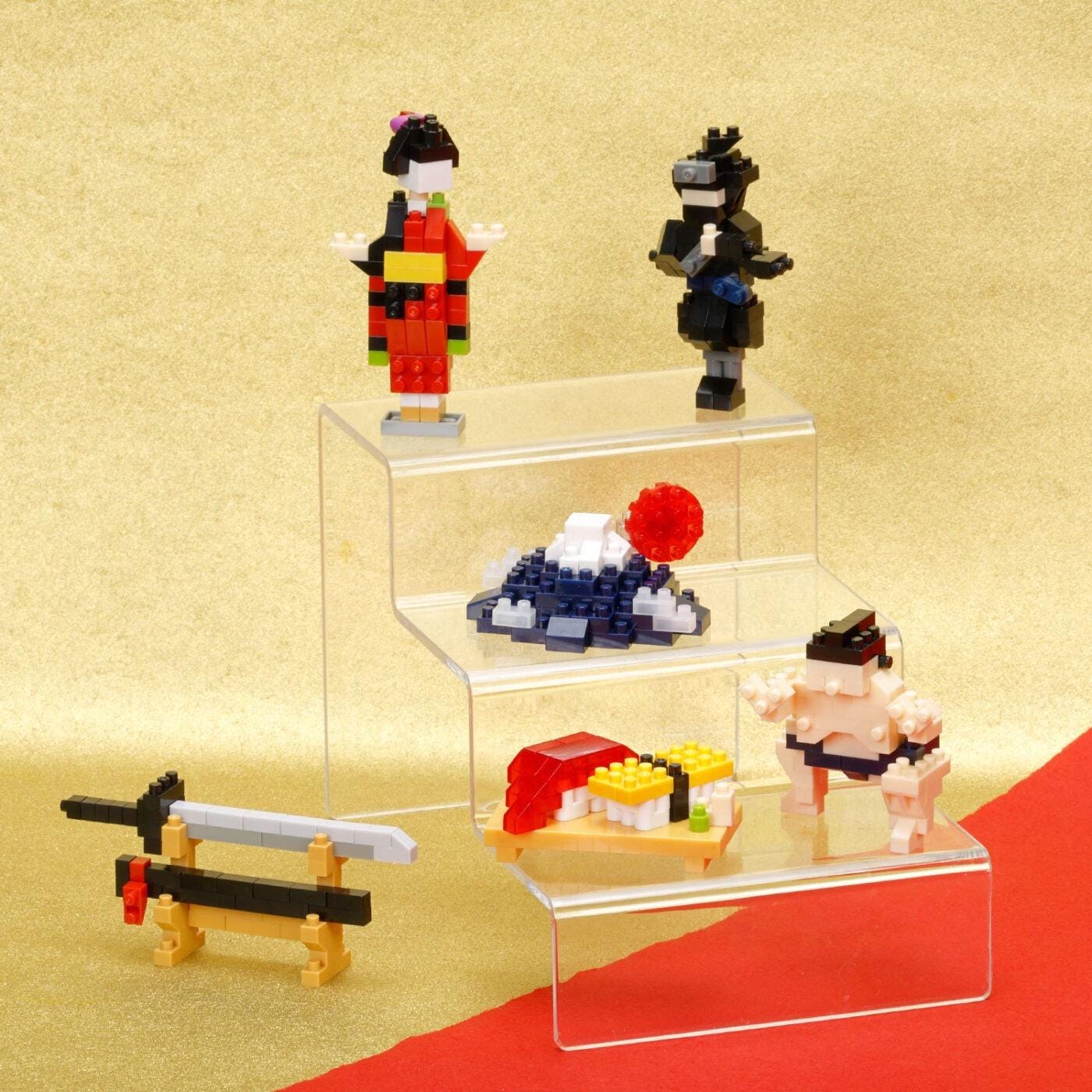 a collection of small, colorful figurines and toys arranged on three clear shelves against a yellow background.