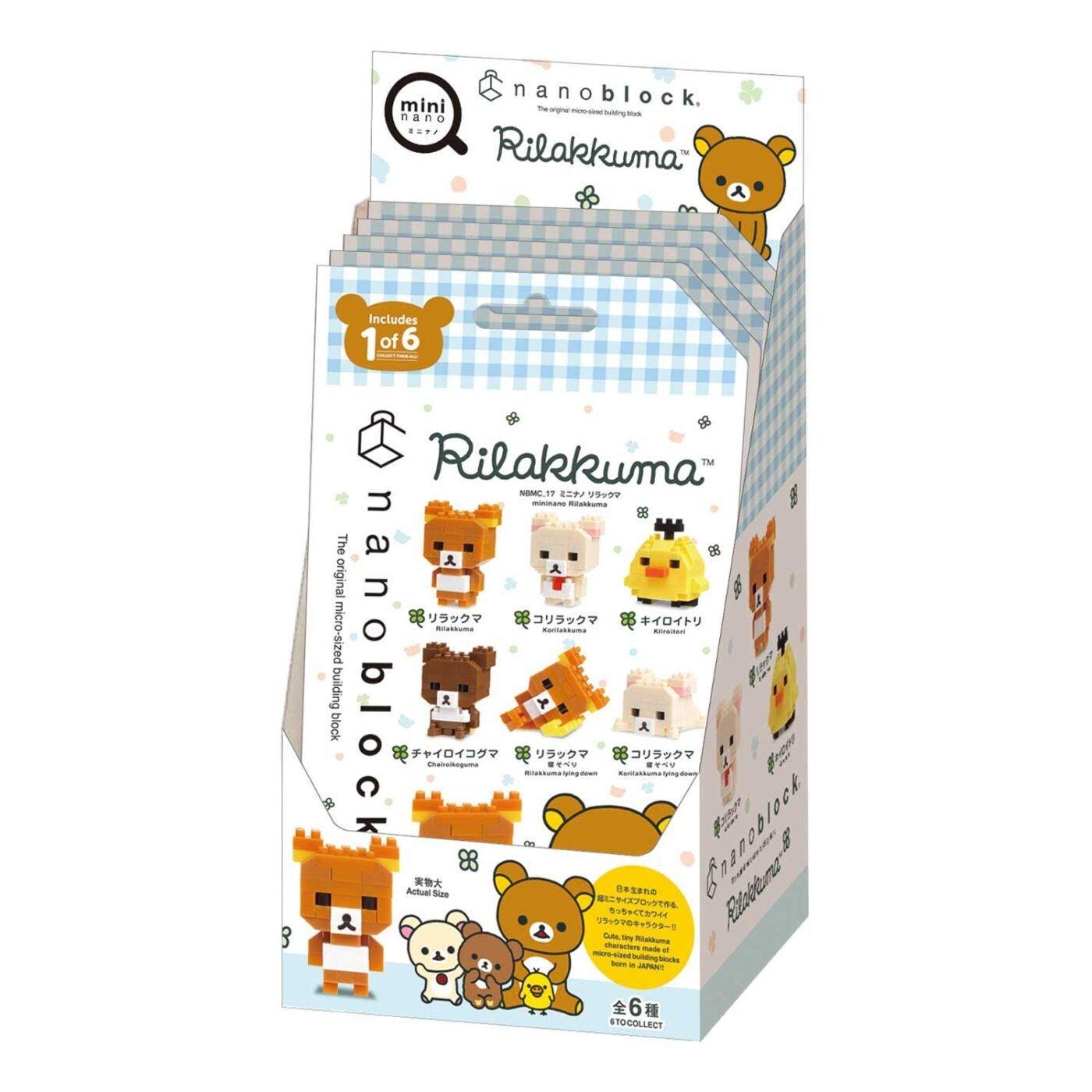A box containing a collection of various cartoon animal figurines, including bears, chickens, and other cute characters.