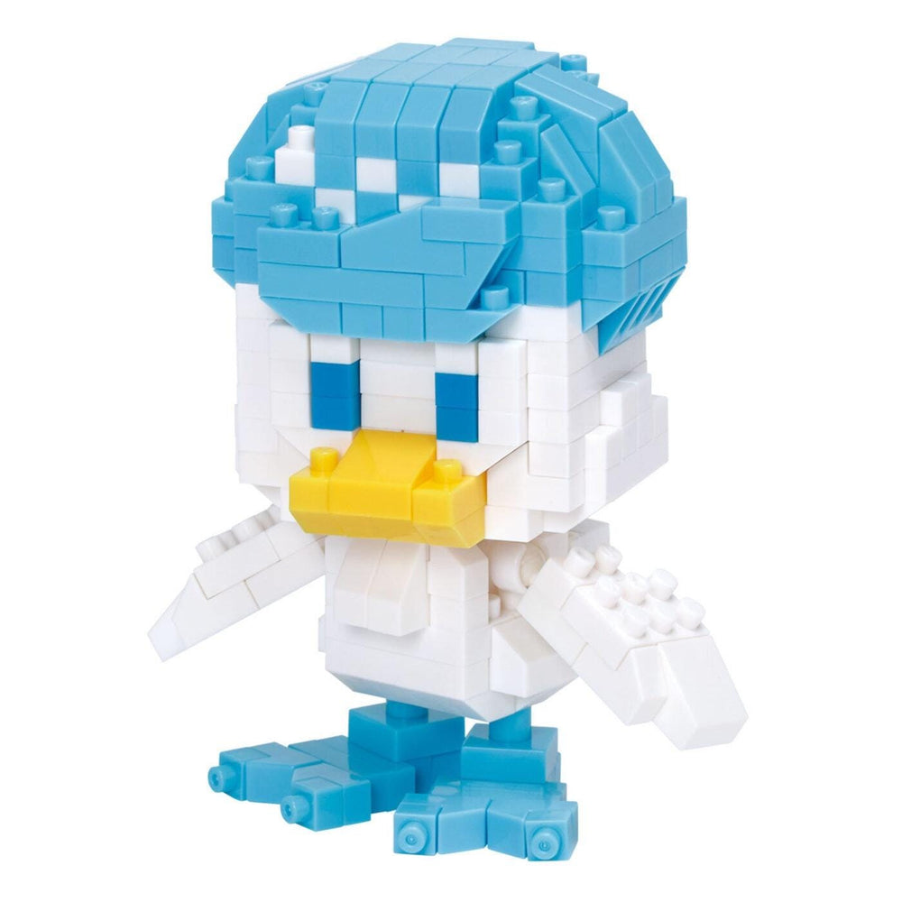 A colorful, pixelated toy figure resembling a duck or bird, composed of various blue and white blocks.