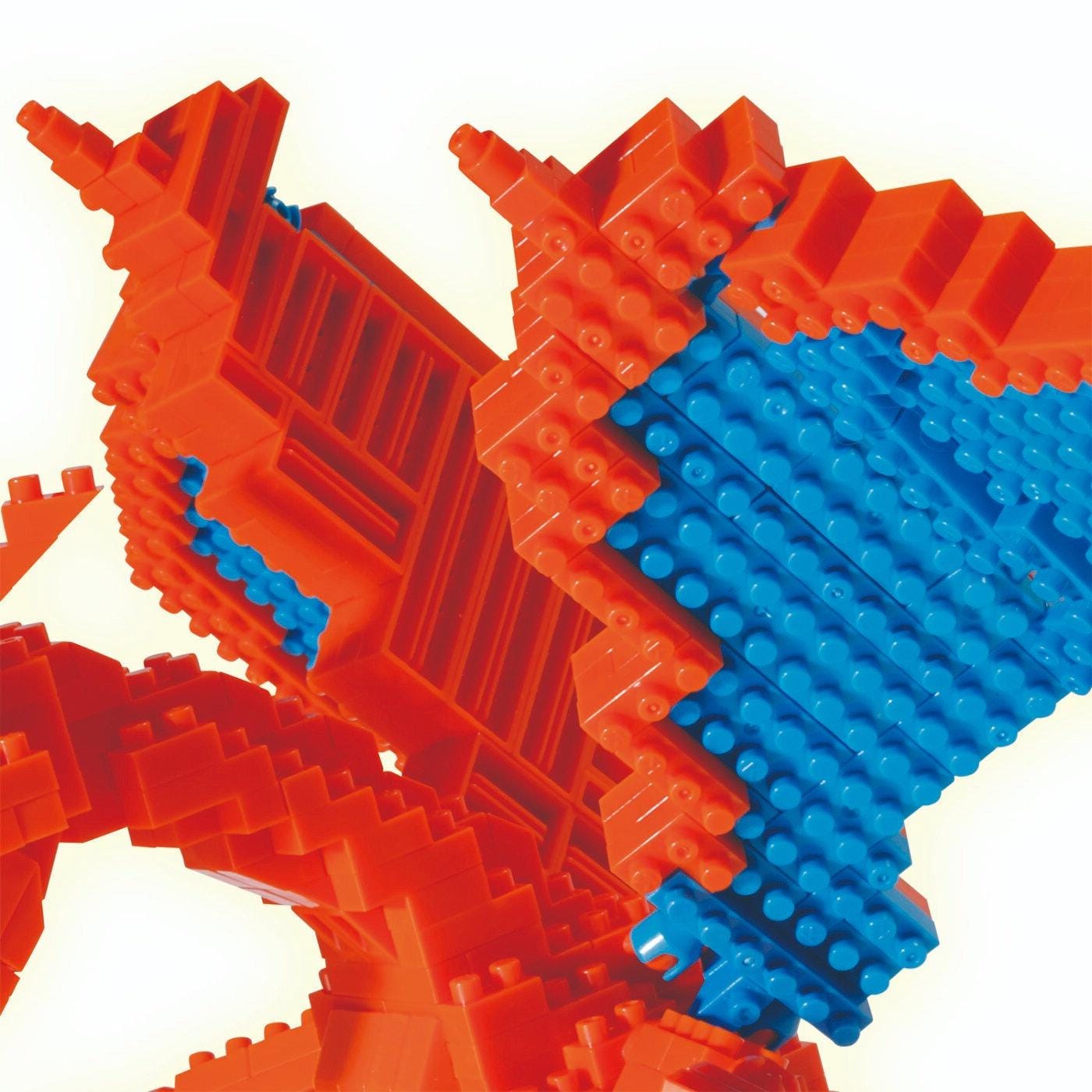 A close-up of a colorful, geometric toy made of red and blue building blocks.