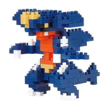 A blue and orange pixelated toy resembling a dinosaur or monster, composed of numerous small blocks.