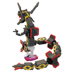 A LEGO snake toy made of black and red bricks, with yellow and red accents, is shown in the image.