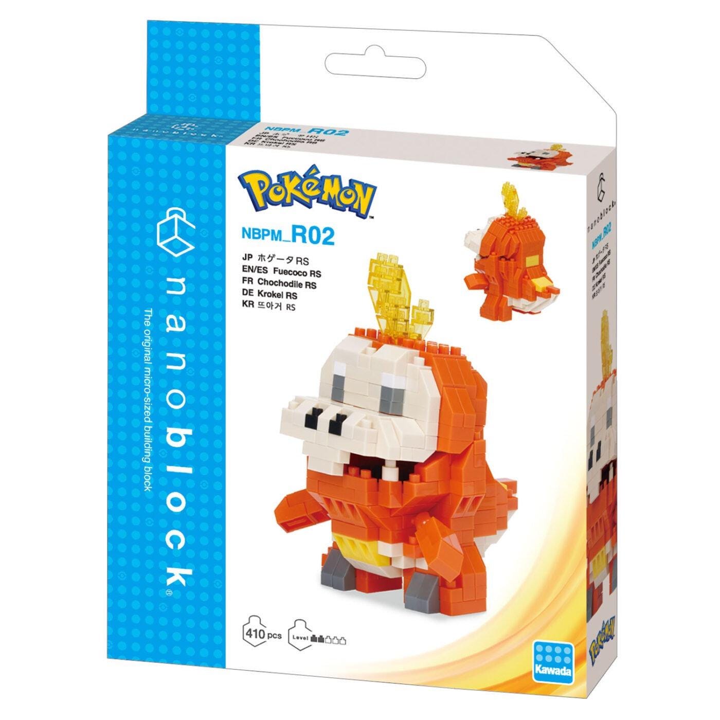 a Pokemon-themed packaging for a NBB block. The packaging is predominantly blue and white, with the Pokemon logo prominently displayed. The packaging includes a detailed image of the NBB block, which is a type of building block toy. The packaging also includes some text, such as "NNBM R02" and "The original micro-sized building block", indicating the product's name and purpose.