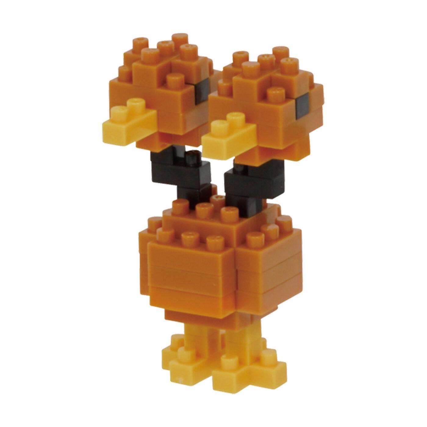 A toy made of small orange and yellow building blocks, resembling a duck or bird.