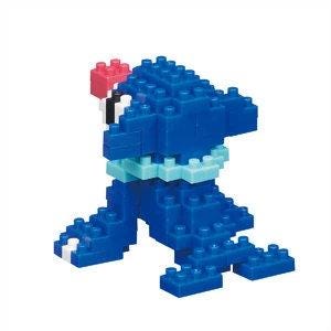 A blue Lego figure with a pink hat and blue scarf, sitting on its hind legs.
