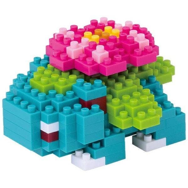 A colorful and intricate 3D model made of various building blocks in different colors, including blue, green, pink, and yellow.