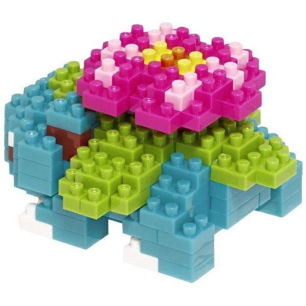 A colorful toy made of various building blocks in different colors, including blue, green, pink, and yellow.