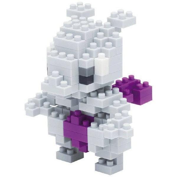 A toy made of small white and purple building blocks, resembling a miniature figure or character.