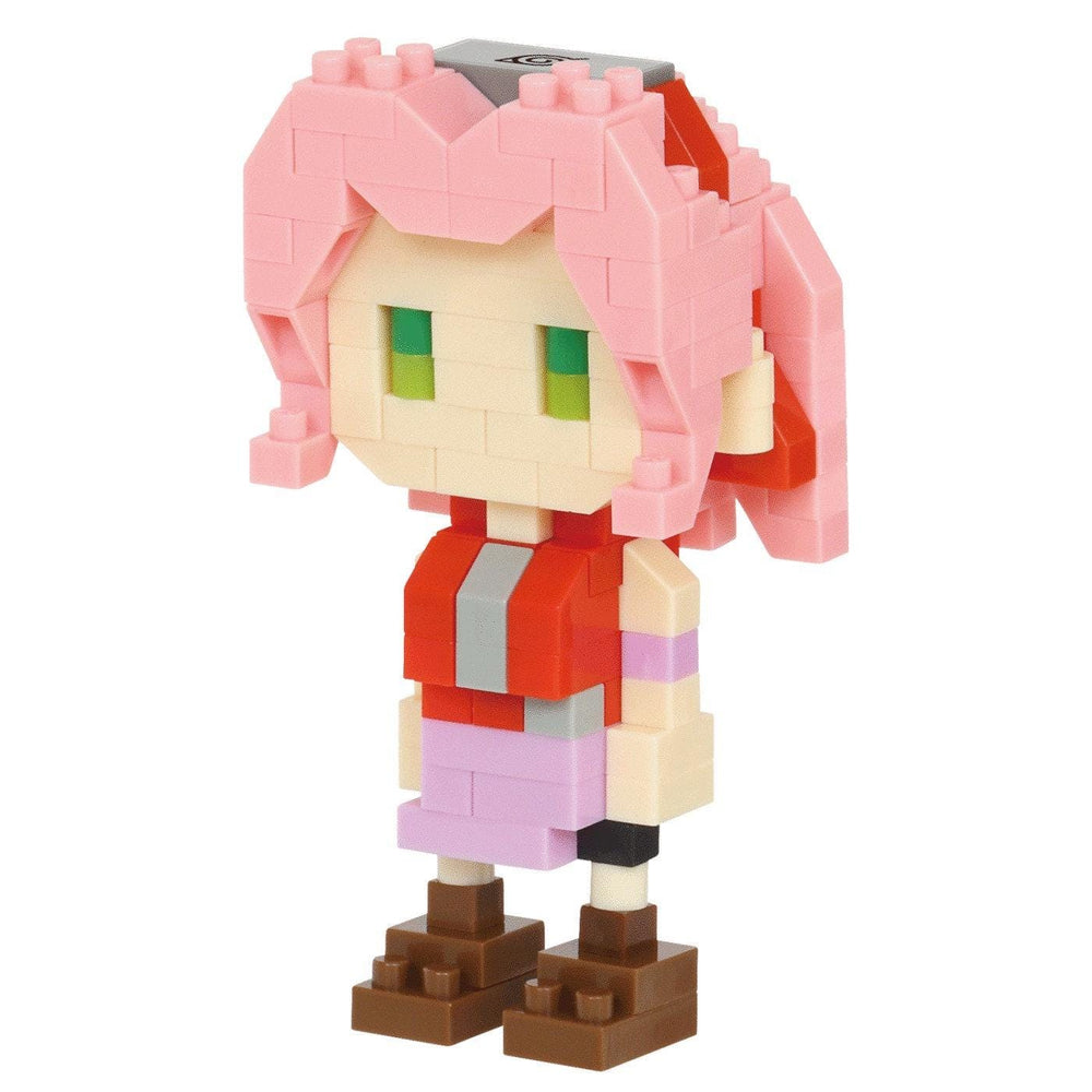 A pink-haired, brick-like figure wearing a red and gray outfit, standing against a white background.