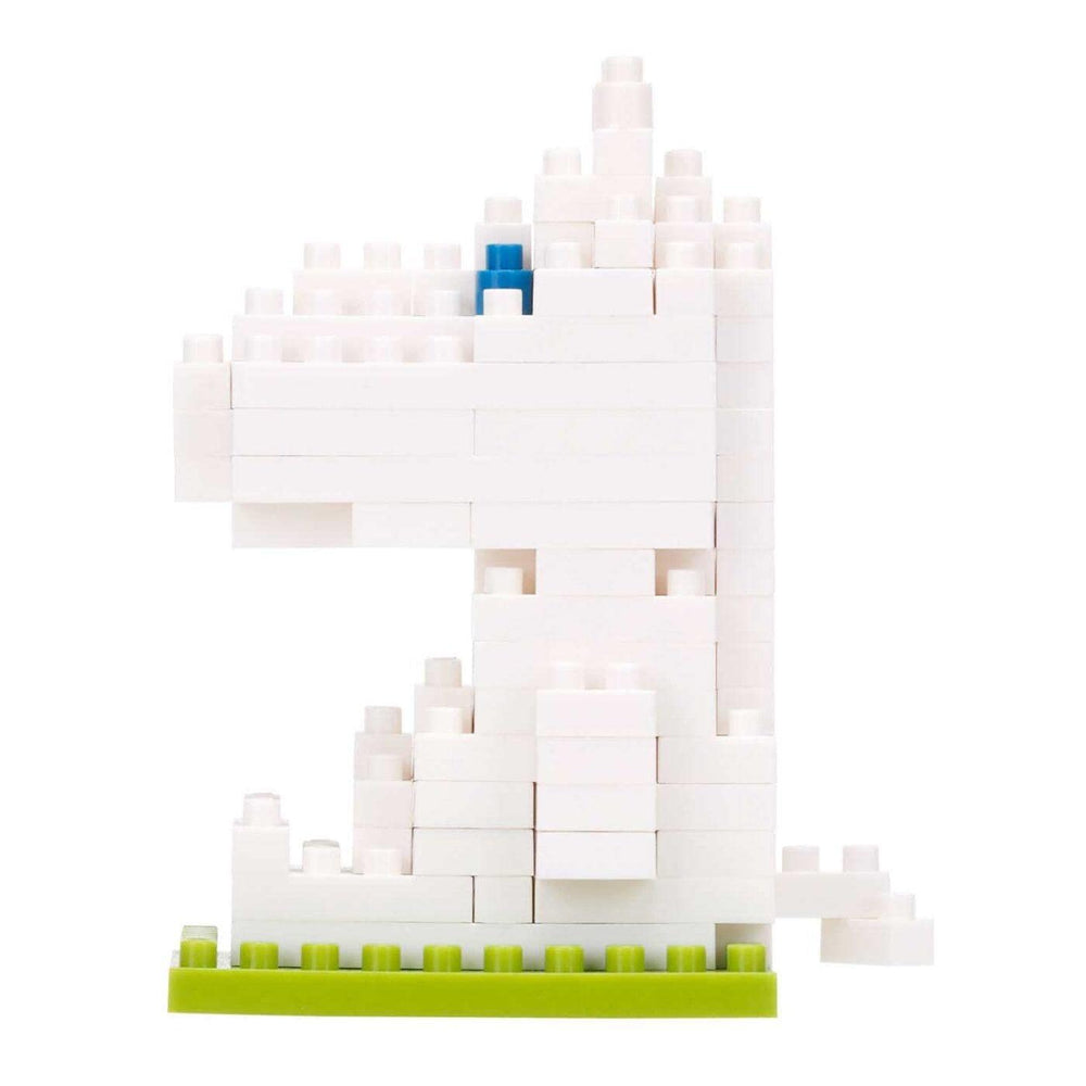 A white LEGO structure composed of numerous small white bricks, with a single blue LEGO brick in the top right corner.