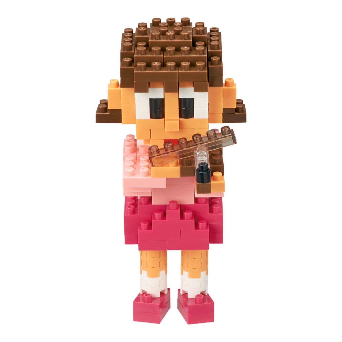 A colorful toy figure of a girl playing a flute, made of small building blocks.