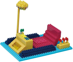 A colorful toy construction set made of various building blocks in different shapes and colors, including a yellow and blue base, a pink and red structure, and a yellow and red structure.