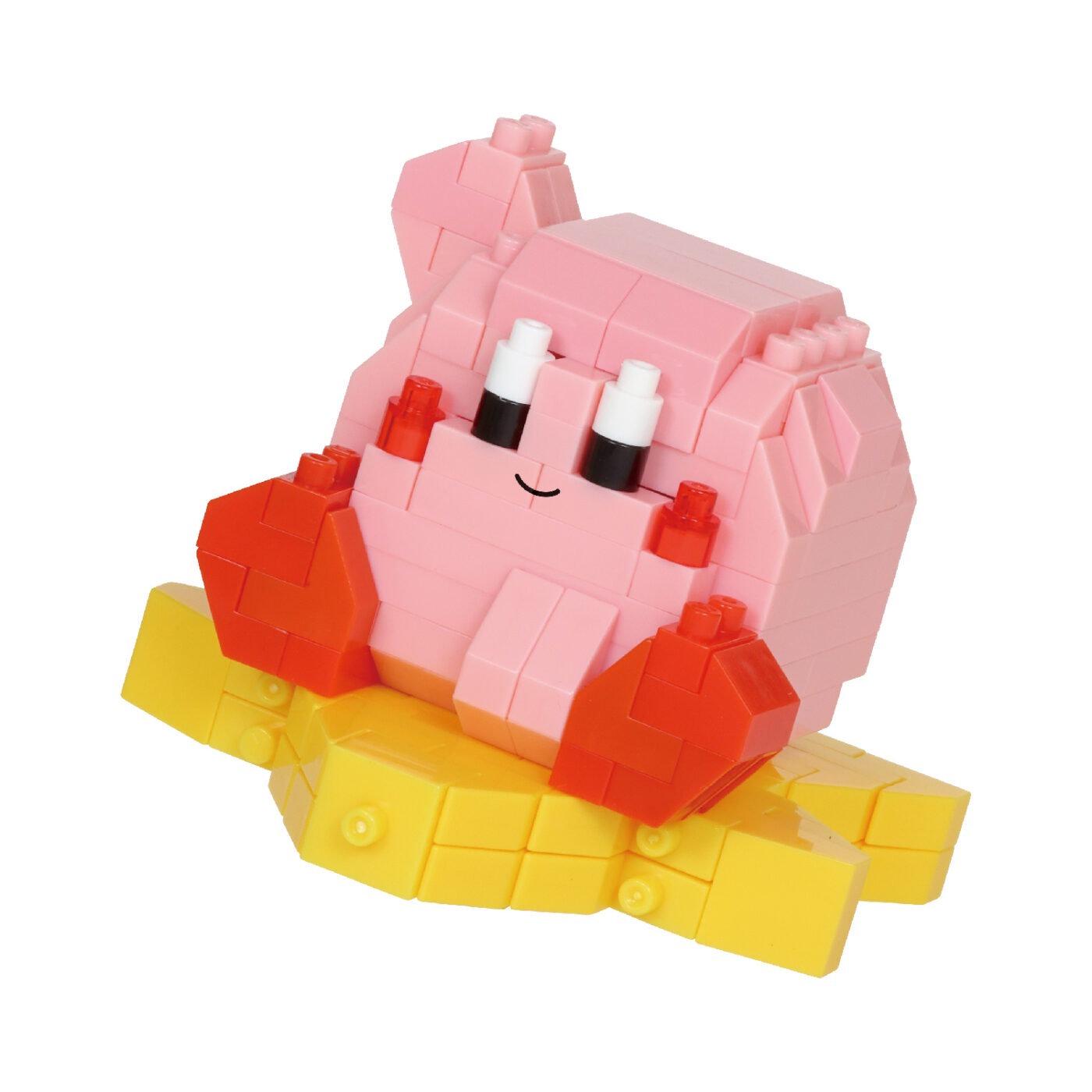A pink and yellow toy figurine made of small building blocks, sitting on a yellow base.