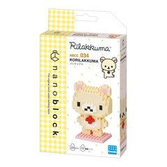 a yellow and white box containing a pixelated bear-shaped building block set.