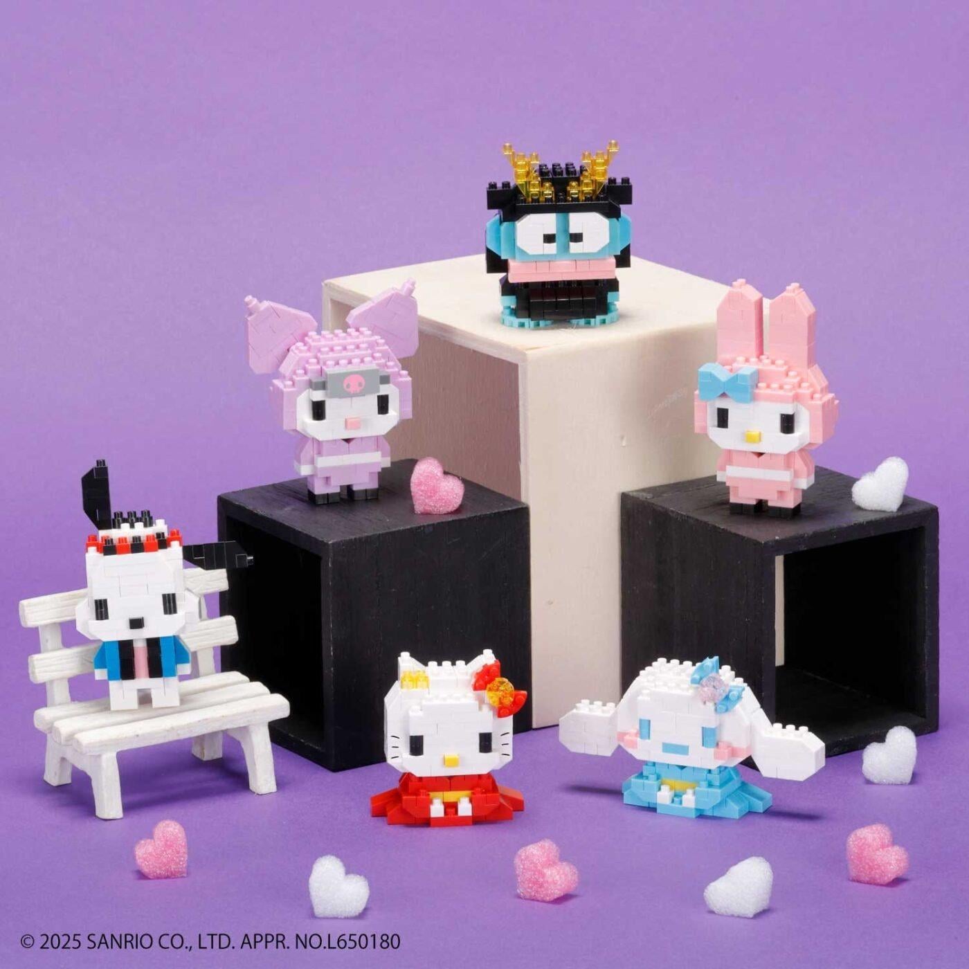 A collection of colorful, pixelated Hello Kitty figurines arranged on a purple background, with some figurines placed on a white pedestal and others on a black surface.