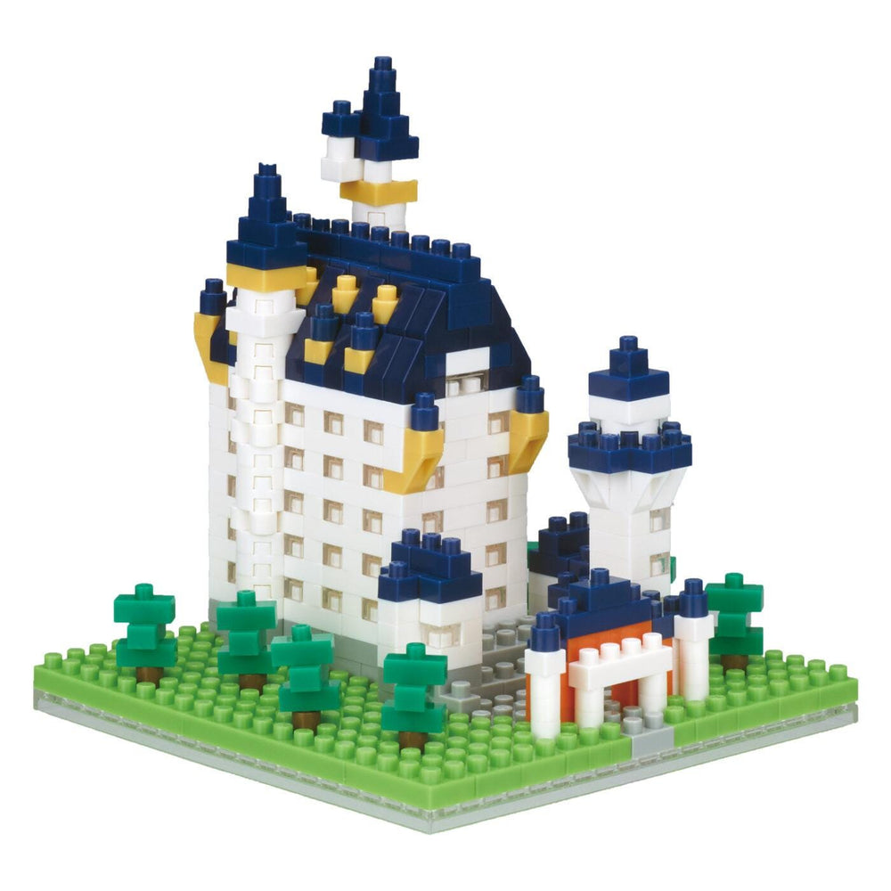 A colorful and detailed model of a castle made out of building blocks, featuring various architectural elements such as towers, turrets, and a moat.