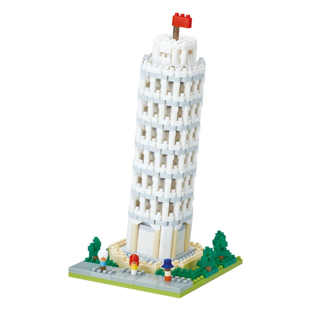 A small, white, brick-like tower with a flag on top, resembling a miniature version of the Leaning Tower of Pisa.
