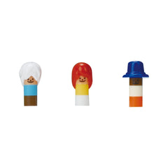 Three colorful toy figures, each with a distinct hairstyle and hat, are arranged in a row.