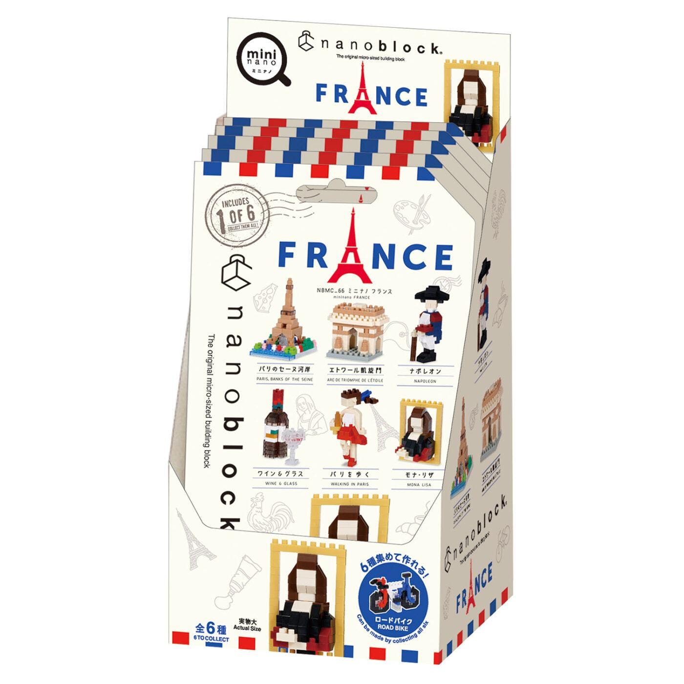 The image is a box containing a collection of French-themed building blocks, including miniature representations of landmarks and scenes.