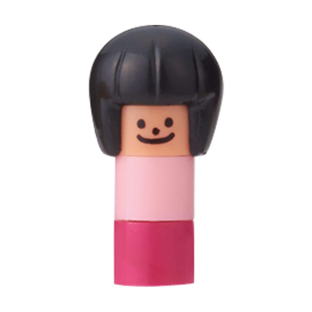 A small, colorful doll with a black hairpiece and a pink dress.