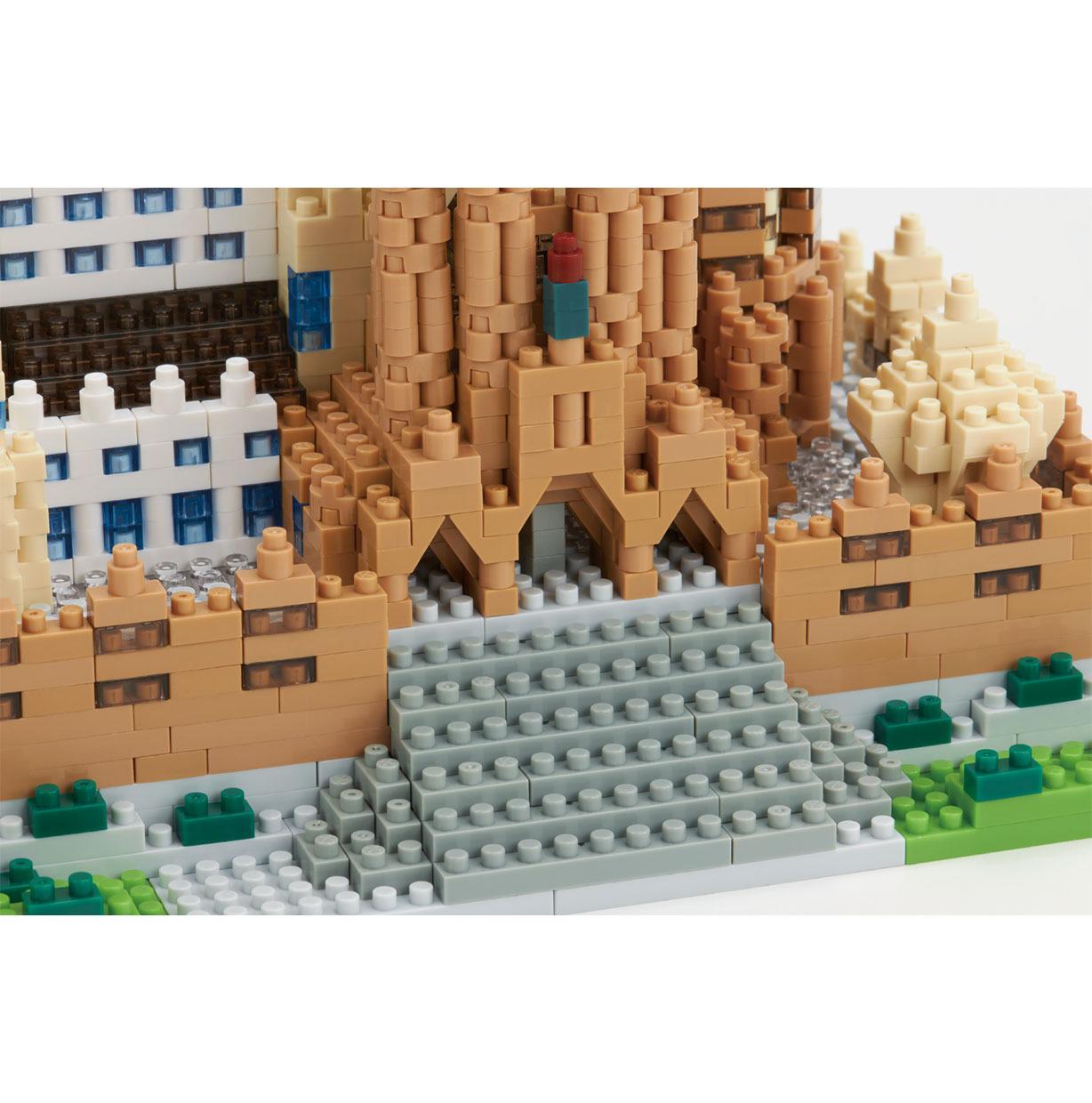 A detailed 3D model of a castle made of Lego bricks, showcasing intricate architectural details and a complex structure.