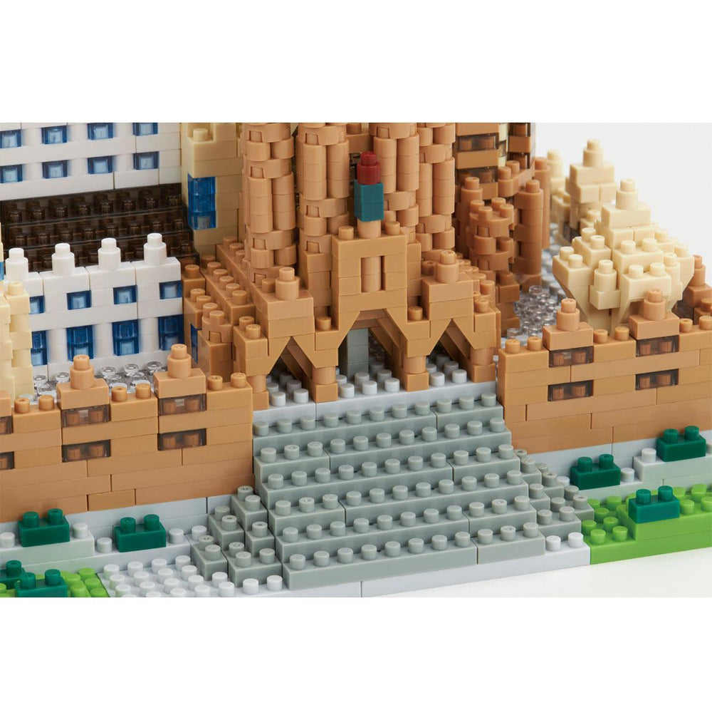 A detailed 3D model of a castle made of Lego bricks, showcasing intricate architectural details and a complex structure.