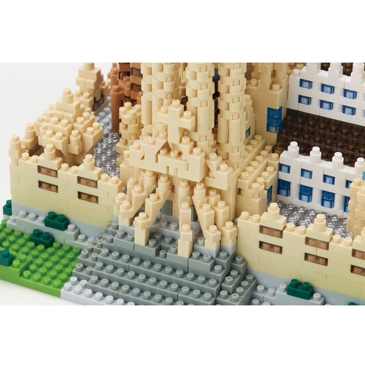 A detailed 3D model of a castle made of small, colorful building blocks.