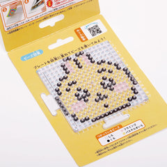 a yellow and black pixelated character design on a yellow background, with instructions and a QR code visible.