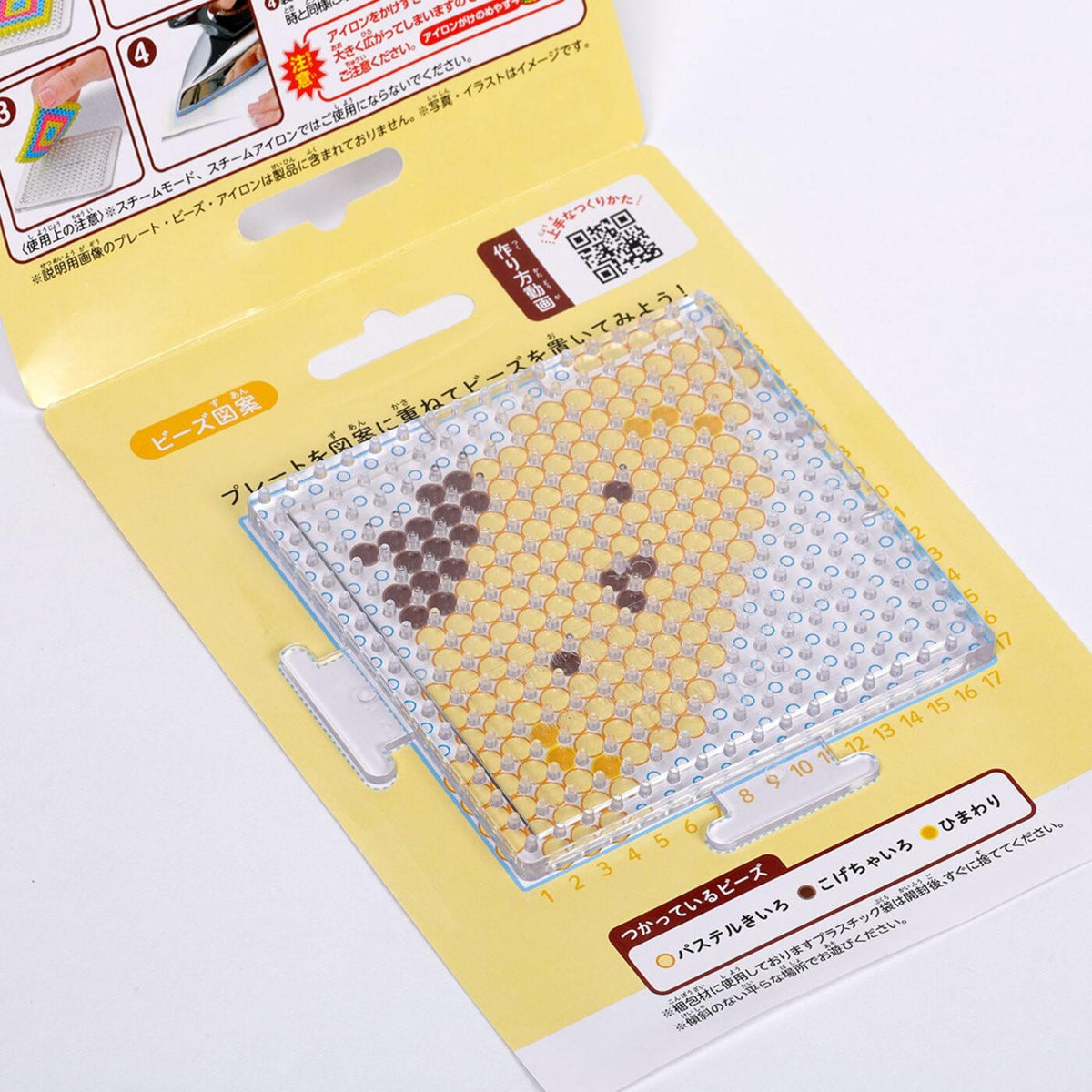 a product packaging for a product with a clear plastic sheet featuring a honeycomb pattern. The packaging has Japanese text and a QR code, indicating that it is a product designed for use in a Japanese setting.