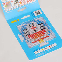a blue and white bead mosaic kit with instructions and a QR code.