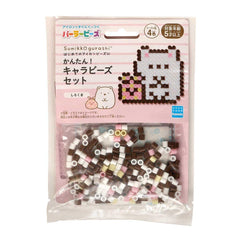 A package of colorful beads in the shape of a cat and a bear, with a pink background and Japanese text.