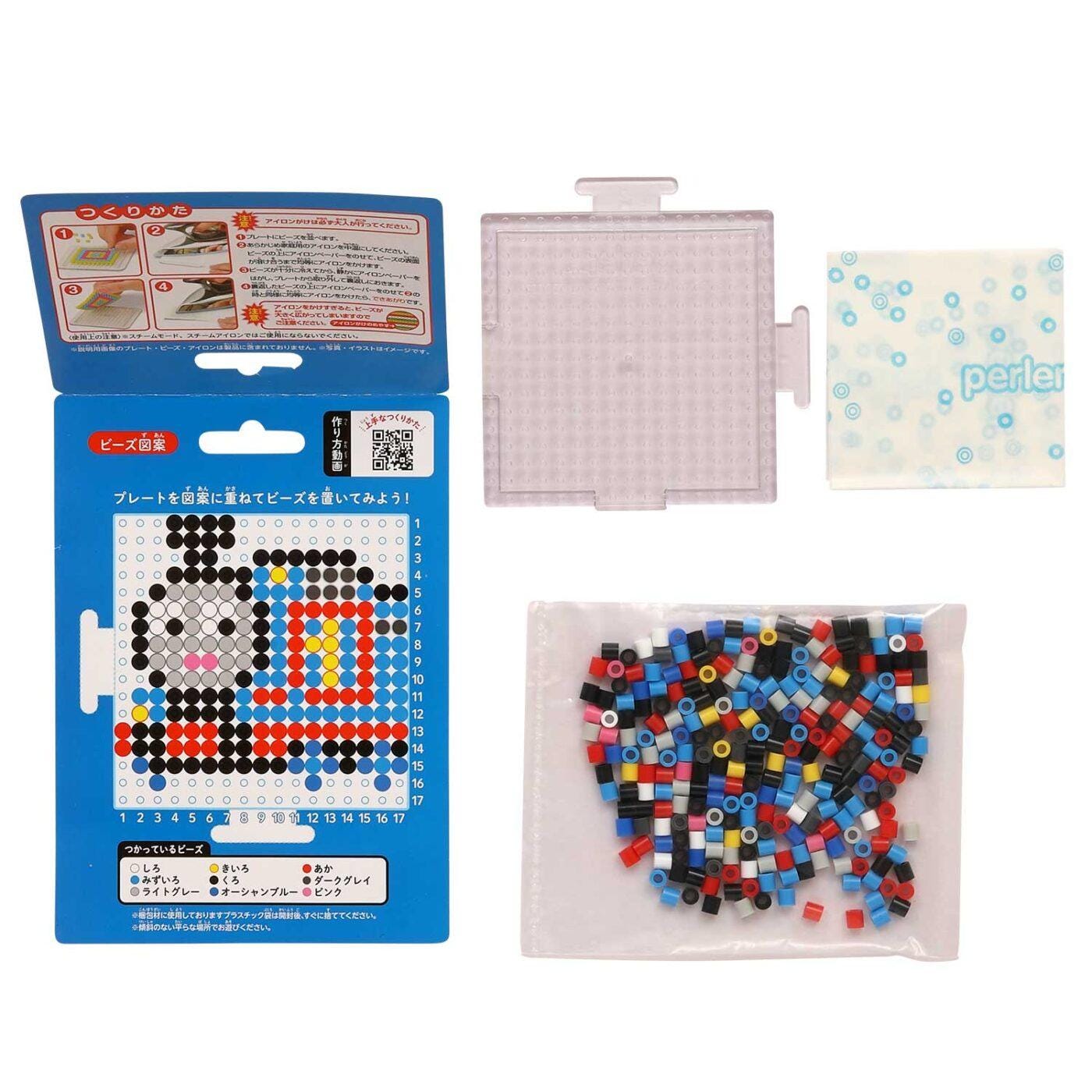 a set of items related to a craft or art project, including a blue box with instructions, a clear plastic container, and a bag filled with colorful beads.