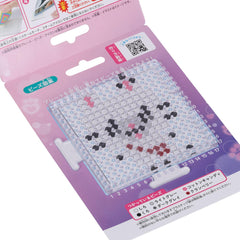 a pink and purple packaging for a product, likely a craft or art supply. The packaging features a grid-like pattern and includes some text in Japanese.
