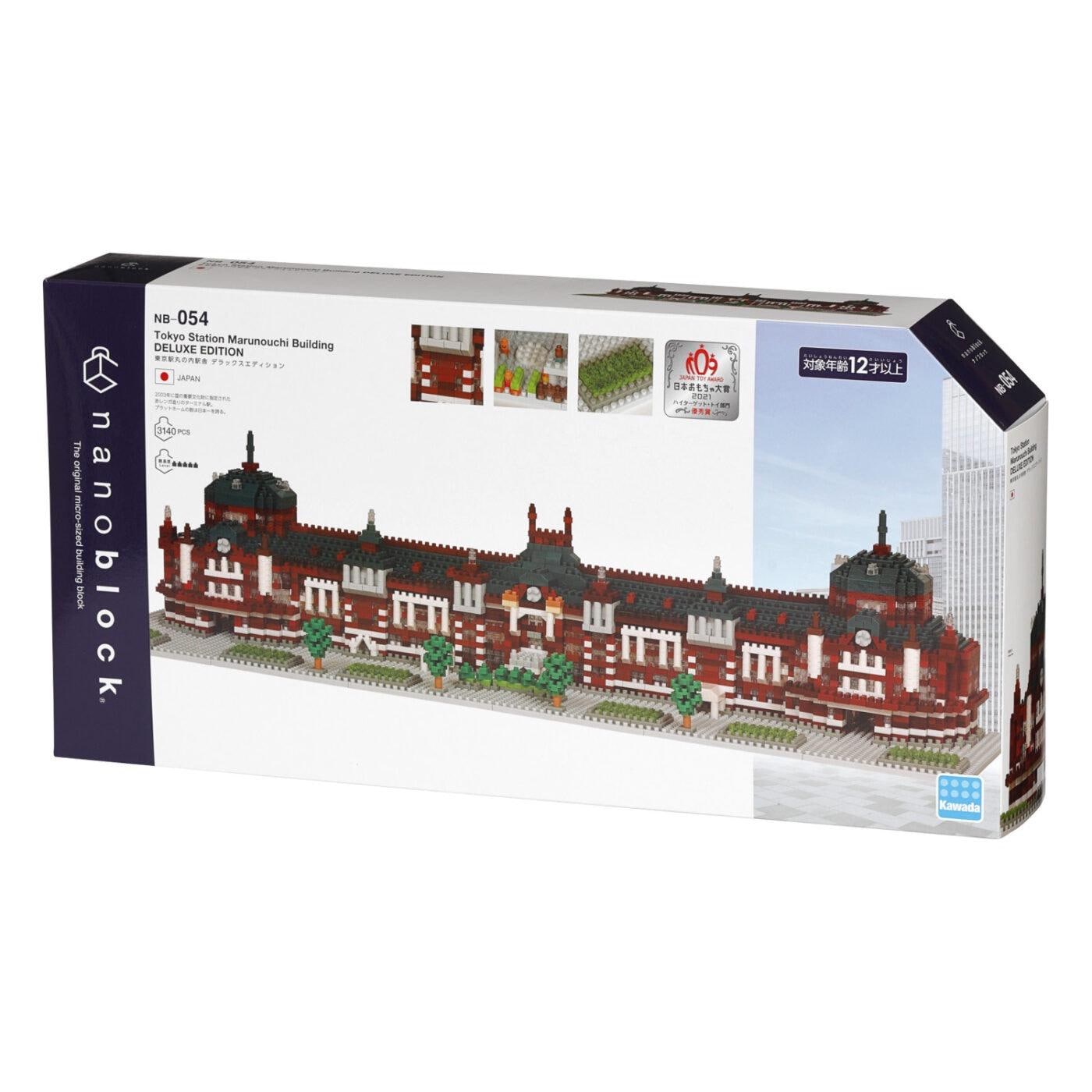 The image is a box containing a model kit for building a miniature replica of the Tokyo Maruouchi Building, a landmark in Tokyo, Japan.