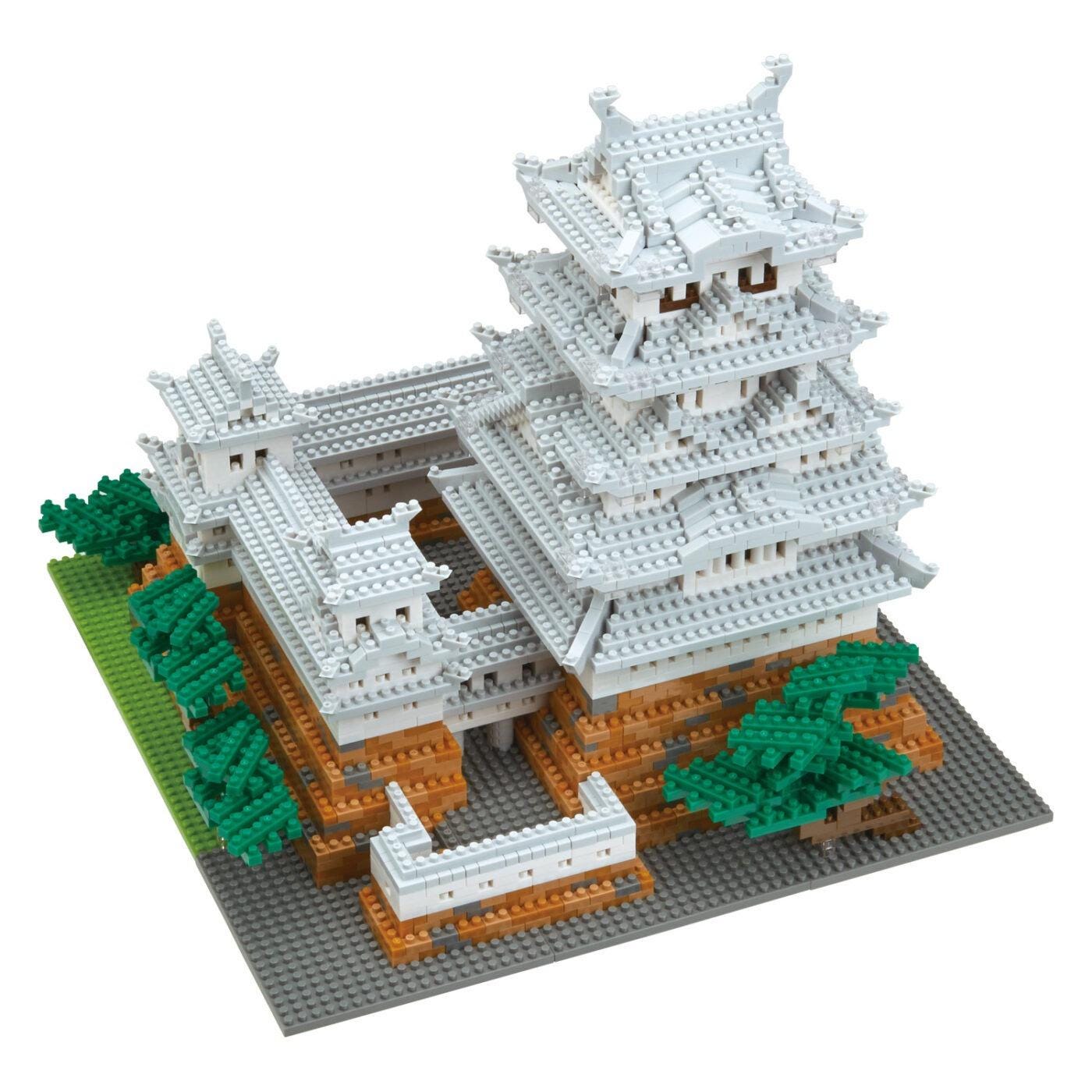 A 3D model of a Japanese castle-like structure made of small, colorful building blocks.