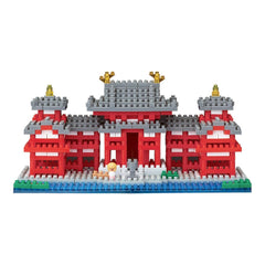 A colorful and intricate model of a traditional Japanese temple, composed of numerous small building blocks in shades of red, white, and gray.