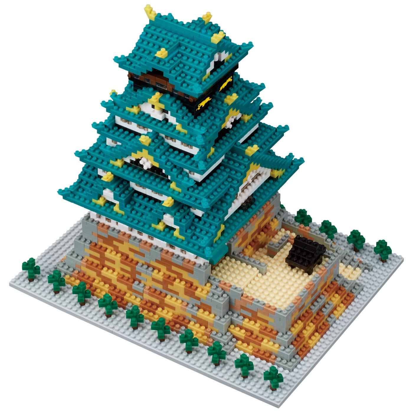 A 3D model of a Japanese castle-like structure made of small, colorful building blocks.