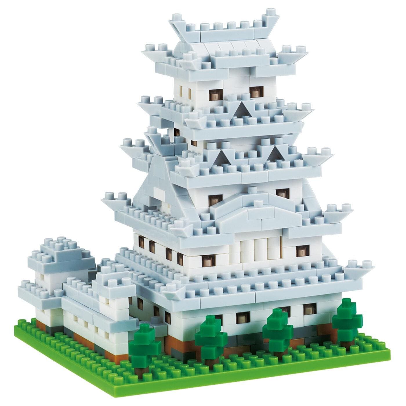 A white, multi-tiered building made of small, white and gray building blocks, resembling a castle or palace.