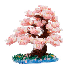A meticulously crafted miniature bonsai tree made entirely of small, colorful building blocks, creating a vibrant and detailed representation of a blossoming tree.