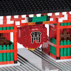 A close-up view of a red lantern with Chinese characters on it, surrounded by a colorful and intricate structure made of building blocks.