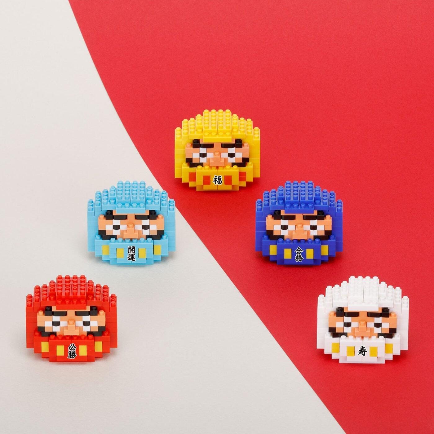 five colorful pixelated characters, each with a distinct face, arranged against a red and white background.