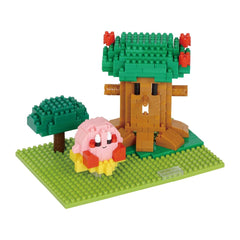 A colorful toy set depicting a tree and a pink character on a green base.