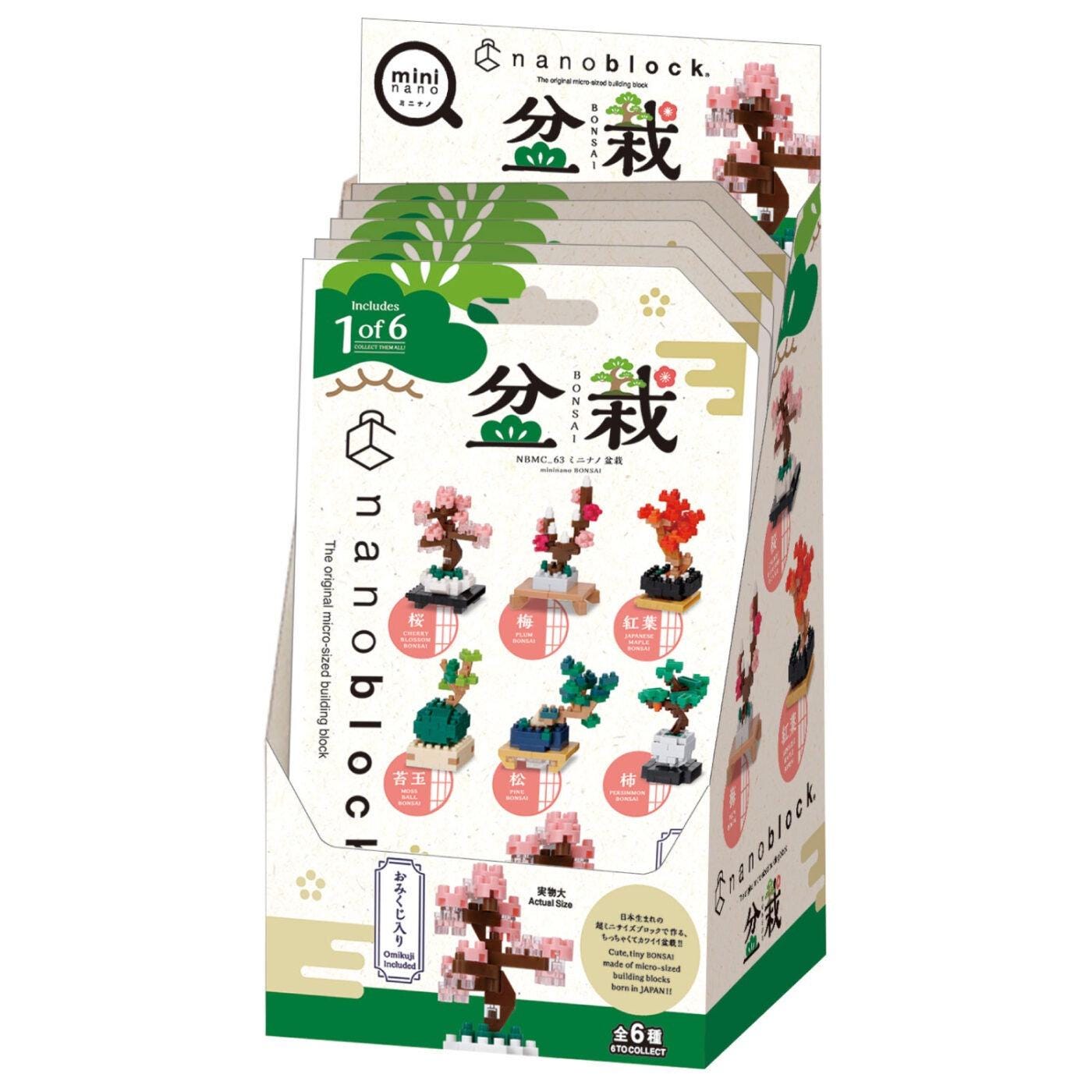 The image is a box containing a set of six different tree-themed building blocks, each with a unique design. The box is predominantly white and green, with various images of the tree blocks displayed on the packaging.