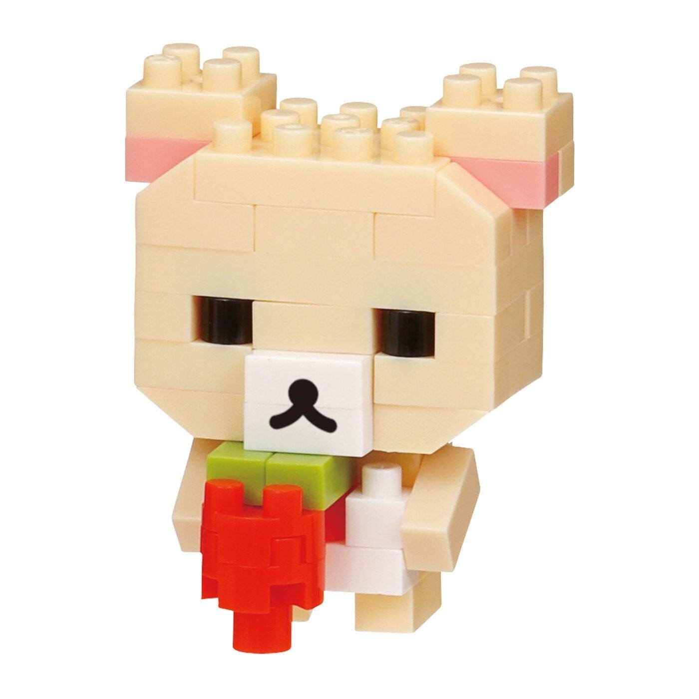 A cute, pixelated toy bear made of building blocks, holding a red heart-shaped block in its mouth.