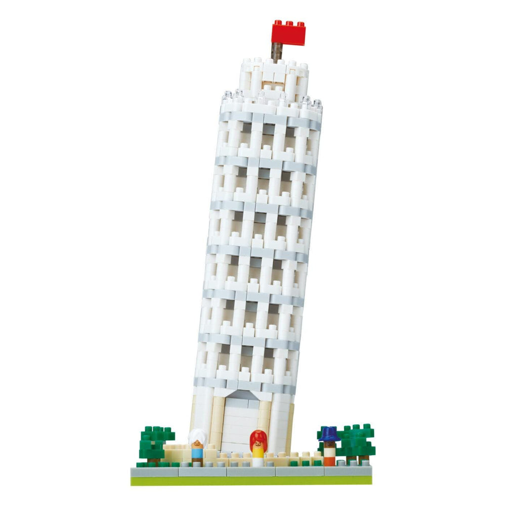 A white Lego tower with a red flag on top, surrounded by green trees and small figures.