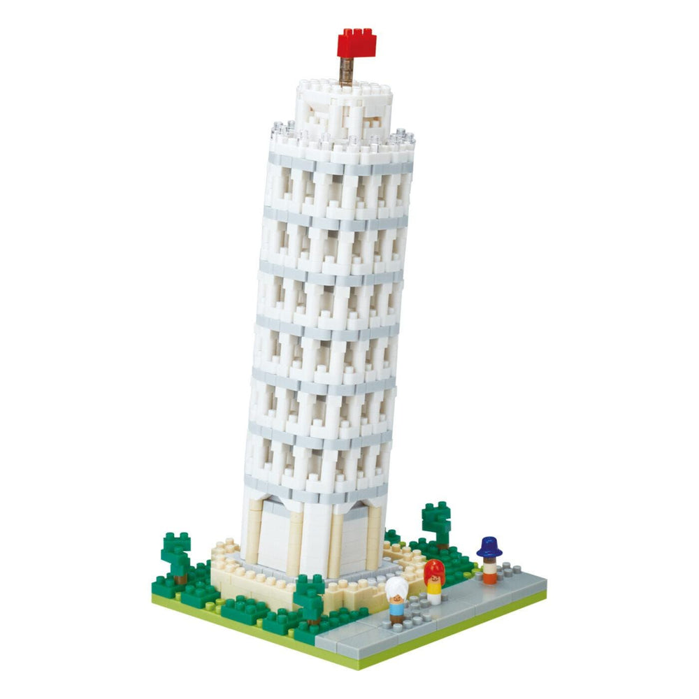 A white Lego tower with a red flag on top, surrounded by green Lego trees and figures.