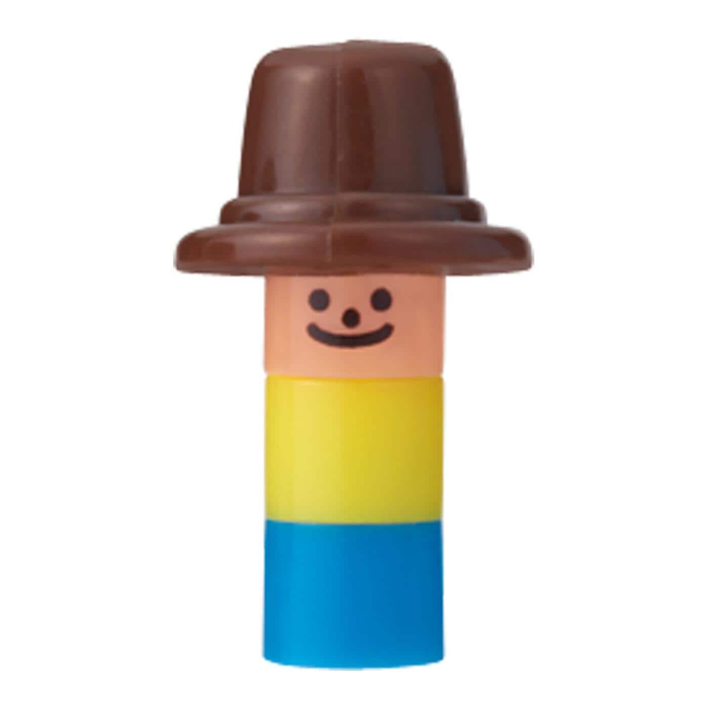 A toy figure wearing a brown hat and a yellow shirt with a smiley face.