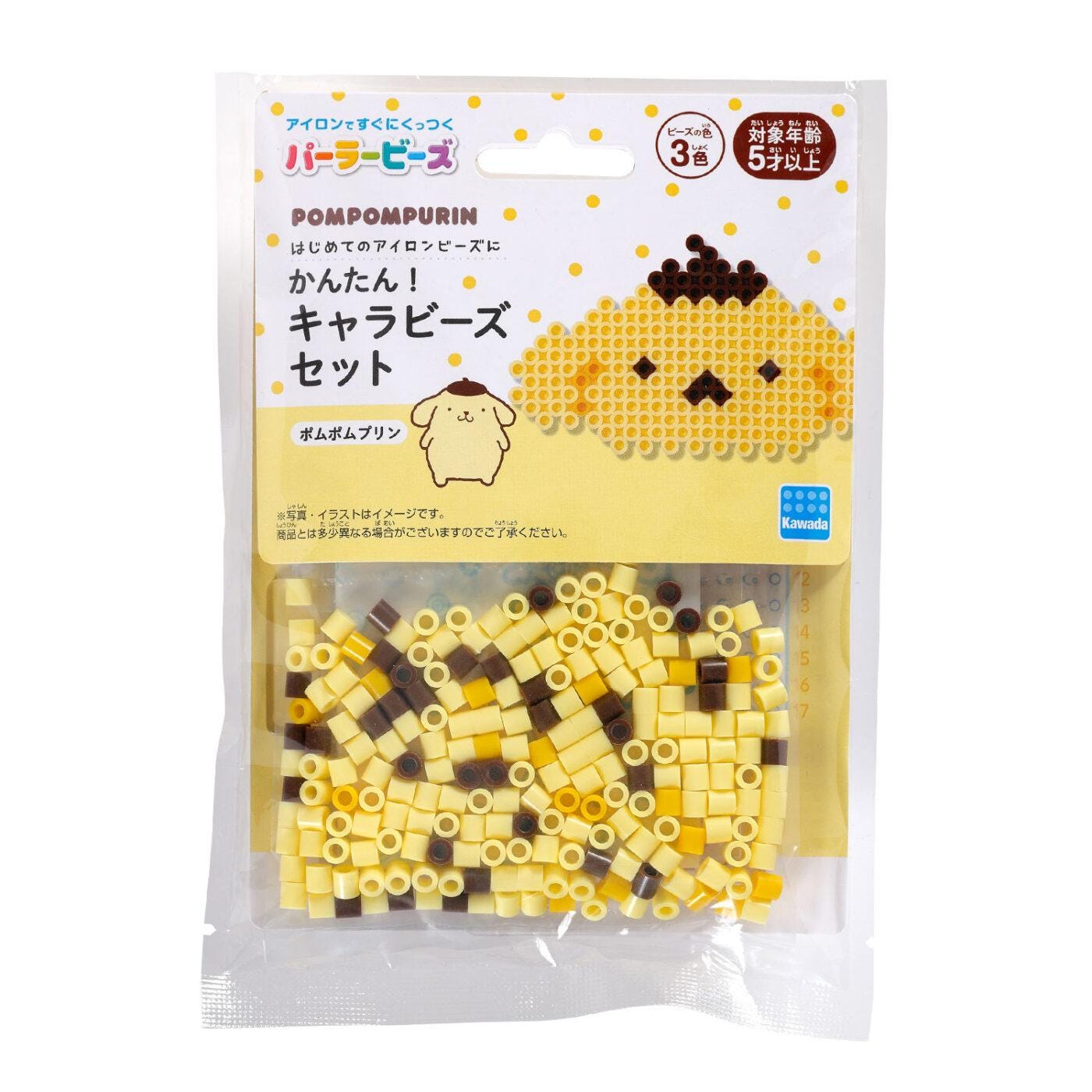 The image is a package of Pomp PURIN beads, which are a popular item for creating pixel art designs. The package is white and contains numerous small yellow and brown beads arranged in a pattern.