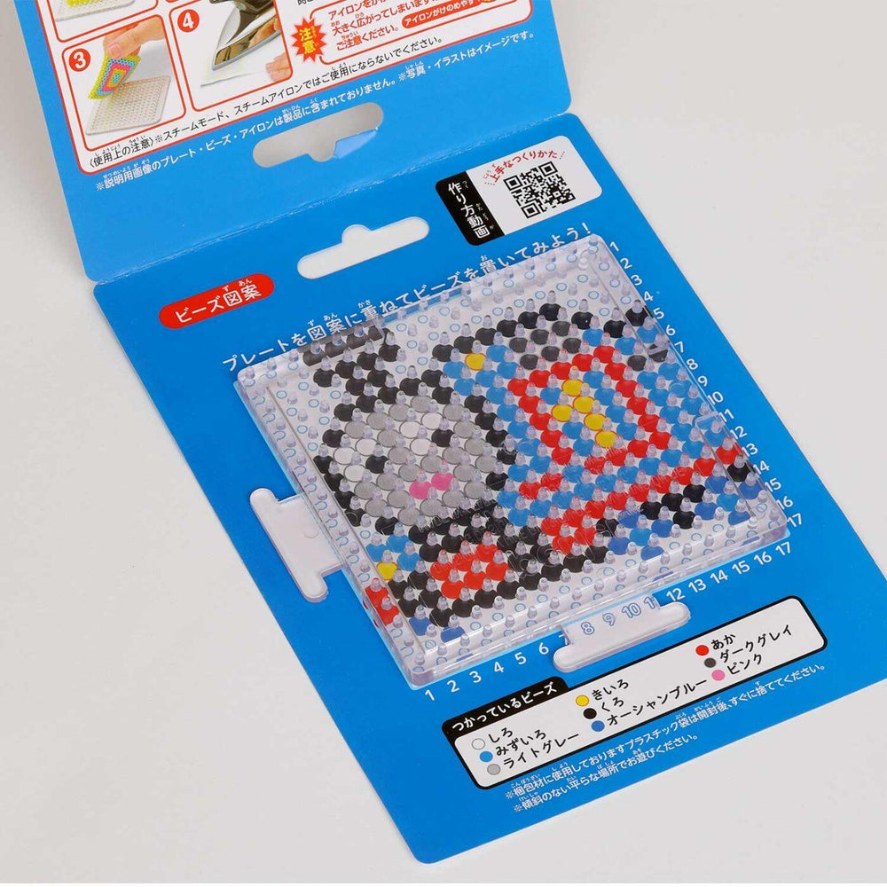 a blue plastic case with a clear plastic window, displaying a pixelated image of a character or design.
